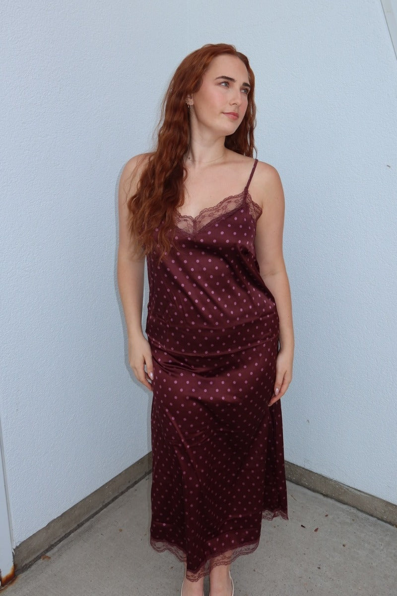 Model wearing the burgundy Iris polka dot lace trim midi skirt with the matching polka dot lace cami, full length front view