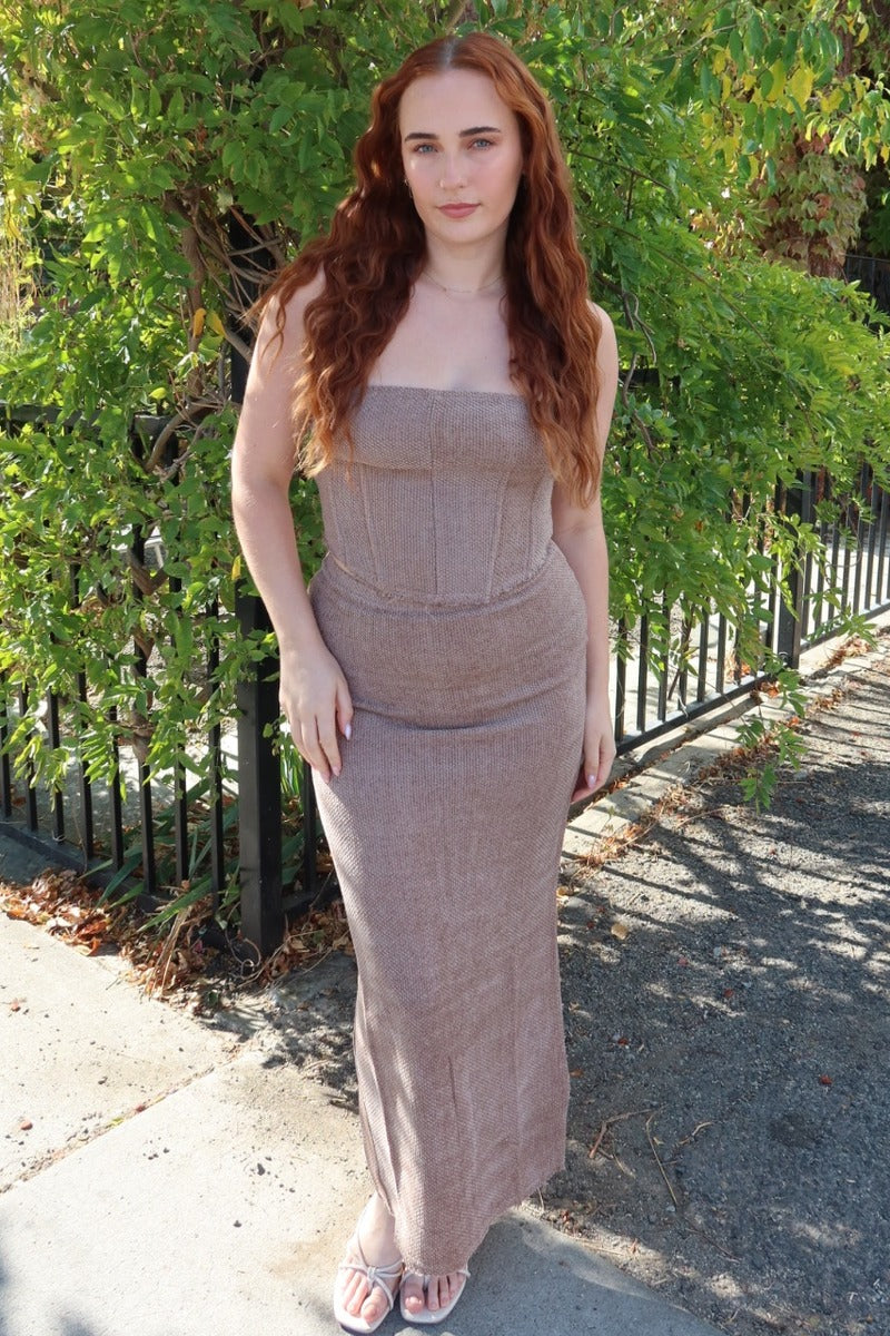 Model wearing the taupe Karmen knitted maxi skirt with the matching corset top, full length front view