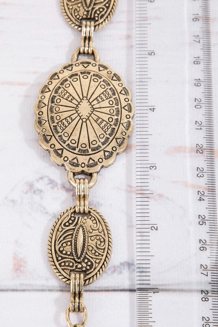 The Concho Disc Chain Belt in Antique Gold - Measurement Detail Shot Showing Concho Disc Size Against Ruler — Approximately 2 Inch Disc Diameter