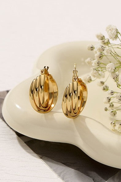 18K INTERTWINED HUGGIE HOOPS