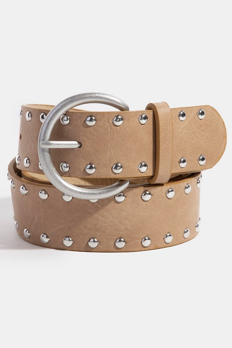 Beige belt with silver studs and buckle on a light gray background