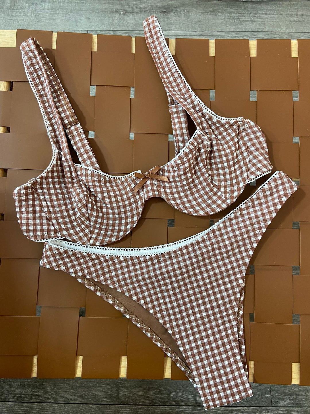 The Cocoa Gingham Underwire Bikini Set - Flat Lay on Rattan Surface Showing Full Set Detail, Lace Trim & Bow Detail