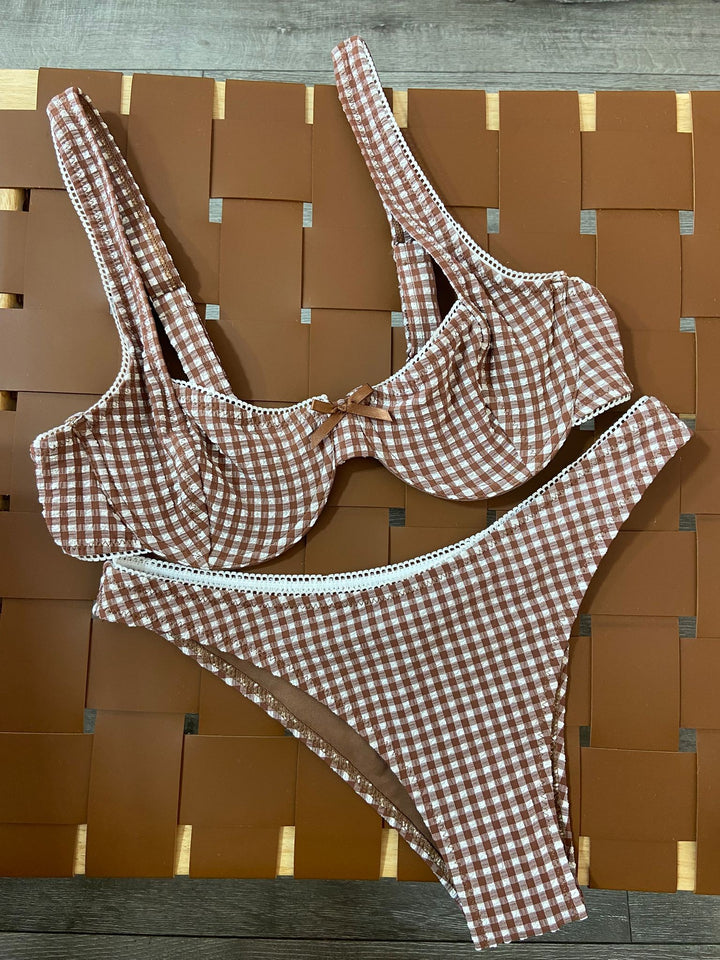 The Cocoa Gingham Underwire Bikini Set - Flat Lay on Rattan Surface Showing Full Set Detail, Lace Trim & Bow Detail