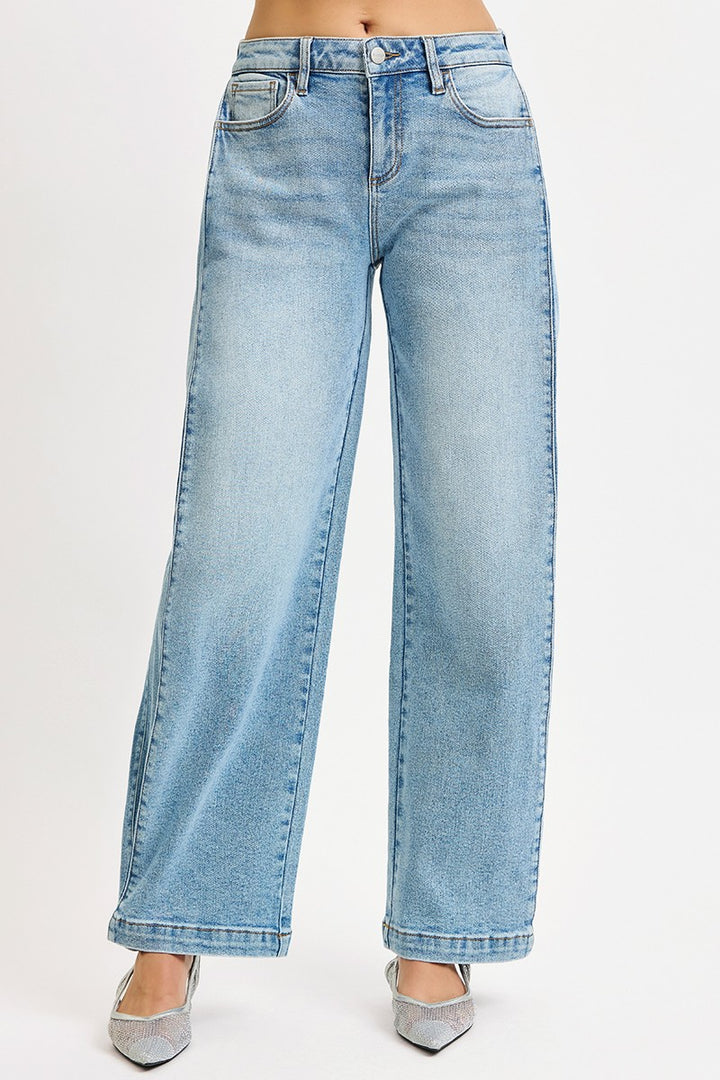 The Wide Barrel Snap Hem Jean in Light Wash — Front View on Model Against White Background Showing Mid-Rise Fit, Wide Barrel Leg Silhouette, Front Seam Detail & Snap-Closed Hem Styled with Silver Kitten Heels