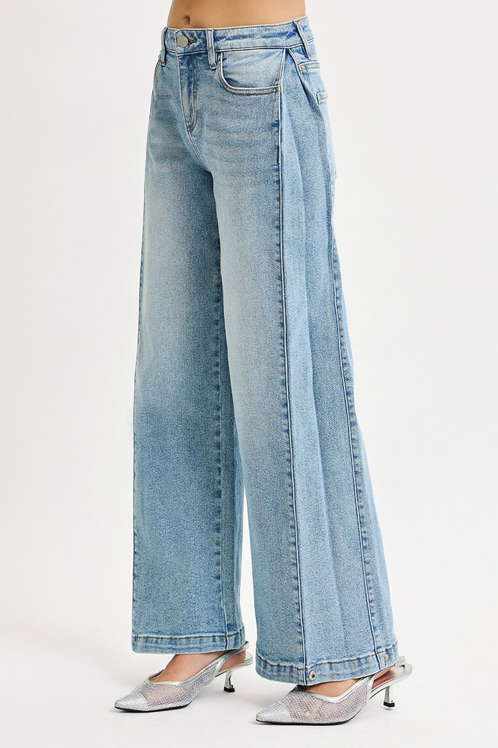 The Wide Barrel Snap Hem Jean in Light Wash — Right Side View on Model Against White Background Showing Wide Barrel Leg Volume, Front Seam Sculptural Detail & Light Wash Faded Denim Finish