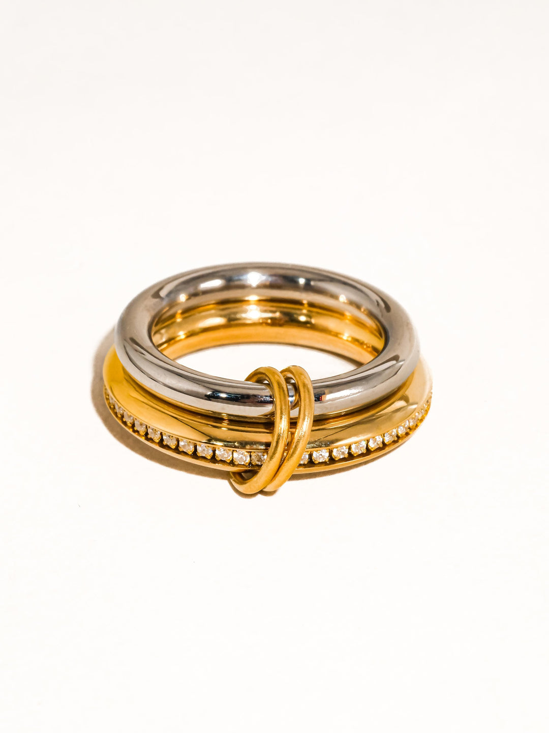 The Multi Stack CZ Band Ring Set in 18K Gold & Silver - Product Shot on White Background Showing Three-Piece Interlocked Ring Set with Polished Silver Band, Gold CZ Channel Band & Slim Gold Connector Ring