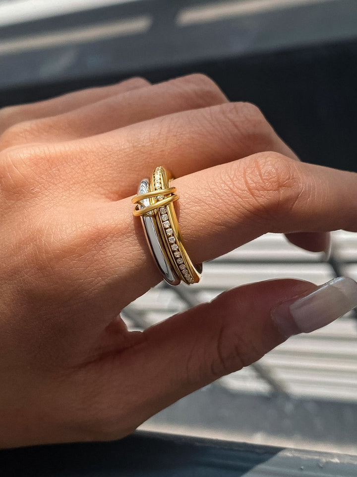 The Multi Stack CZ Band Ring Set in 18K Gold & Silver - On-Model Close-Up Showing Full Three-Piece Stack Worn Together on Ring Finger with Mixed Metal Gold & Silver Contrast