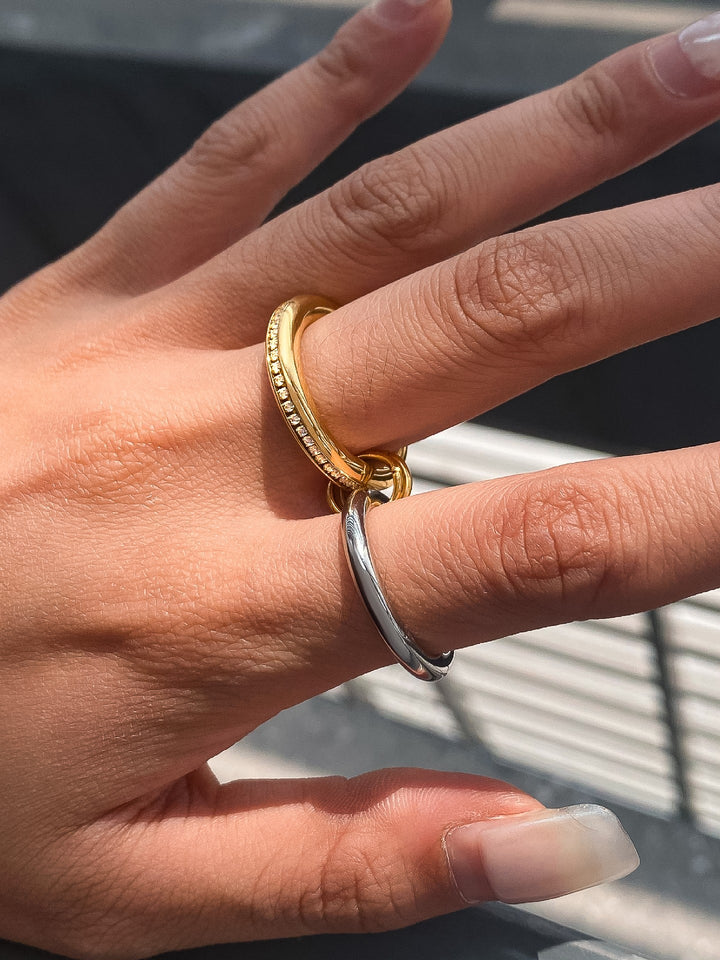 The Multi Stack CZ Band Ring Set in 18K Gold & Silver - On-Model Styling Shot Showing Gold CZ Channel Band & Slim Connector Ring Worn on One Finger with Silver Band Worn Separately on Adjacent Finger