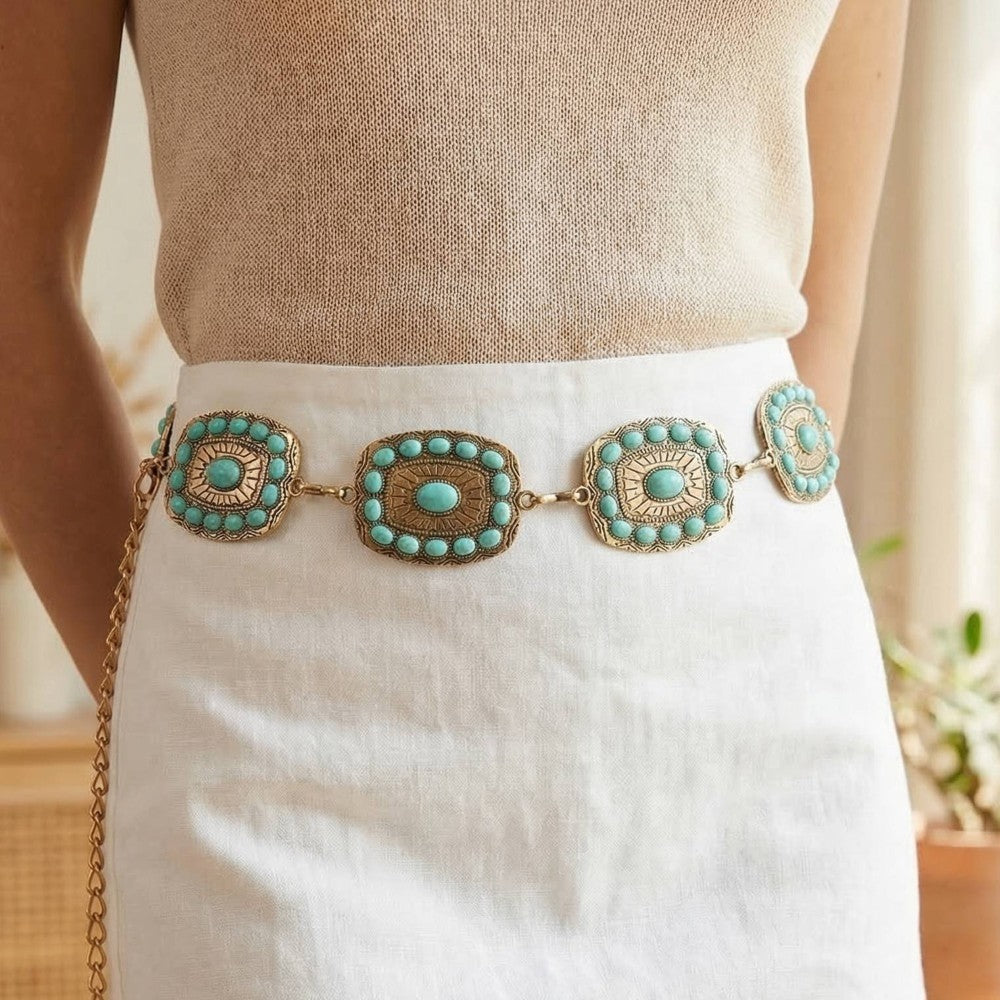 The Mesa Turquoise Rectangle Concho Chain Belt in Gold - Styled on Model at Waist Over Cream Knit Top & White Linen Skirt Showing Rectangle Concho Plaques with Turquoise Halo Studs