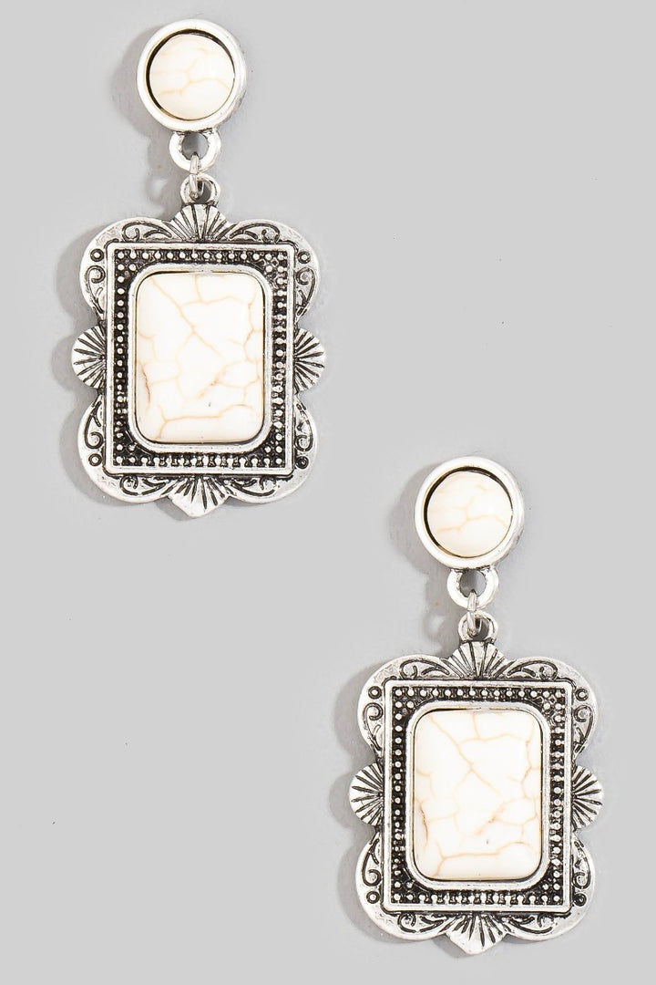 The Concho Rectangle Stone Drop Earrings in White Howlite - Product Shot on Grey Background Showing Pair of Antique Silver Rectangle Concho Drop Earrings with White Howlite Center Stones & Round Stud Posts