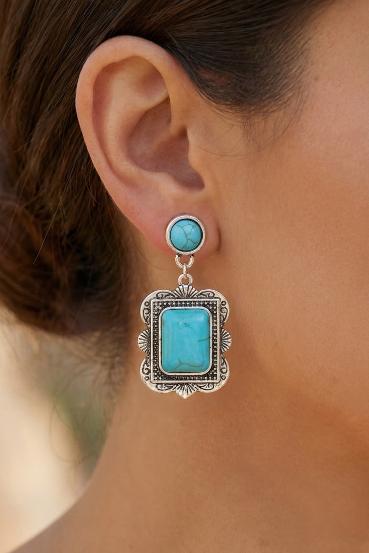 The Concho Rectangle Stone Drop Earrings in Turquoise - On-Model Close-Up Showing Round Turquoise Stud Post & Ornate Antique Silver Rectangle Concho Drop with Turquoise Center Stone