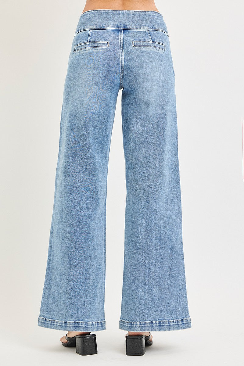 Risen Tummy Control Wide Waistband Wide Leg Jean in Light Wash — Back View on Model Against Off-White Background Showing Back Welt Pockets, Wide Leg Silhouette & Light Wash Faded Denim Finish