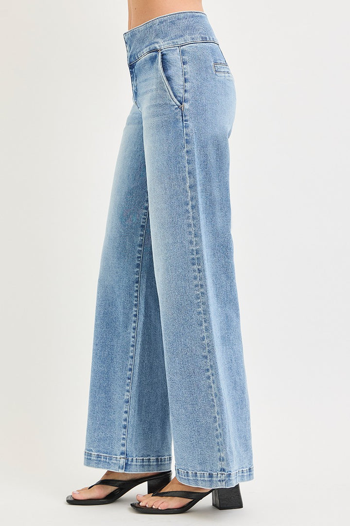 Risen Tummy Control Wide Waistband Wide Leg Jean in Light Wash — Side View on Model Against Off-White Background Showing Wide Waistband Profile, Front Seam Detail Running Full Length of Wide Leg & Side Pocket