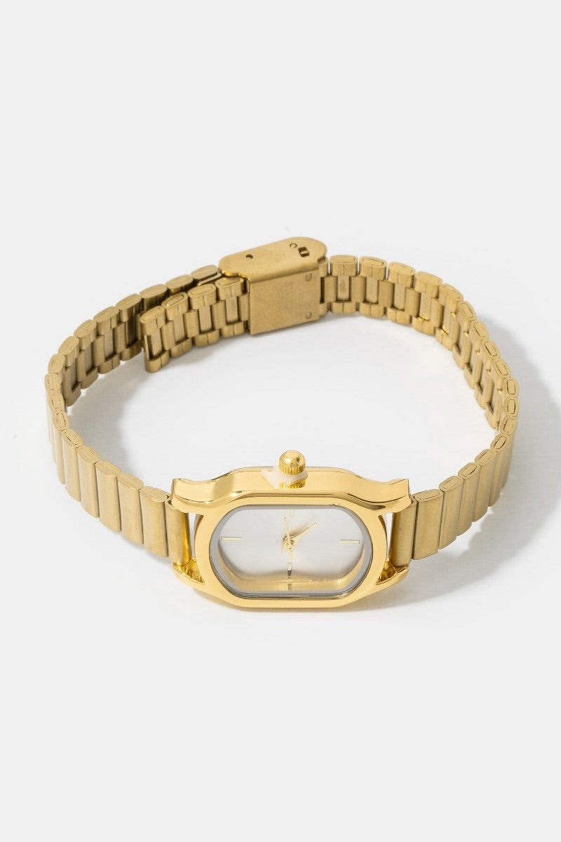 The Cushion Rectangle Bangle Watch in Gold - Three-Quarter Product Shot on White Background Showing Cushion Rectangle Case, Pearl White Dial with Gold Baton Indices & Ribbed Bracelet Band