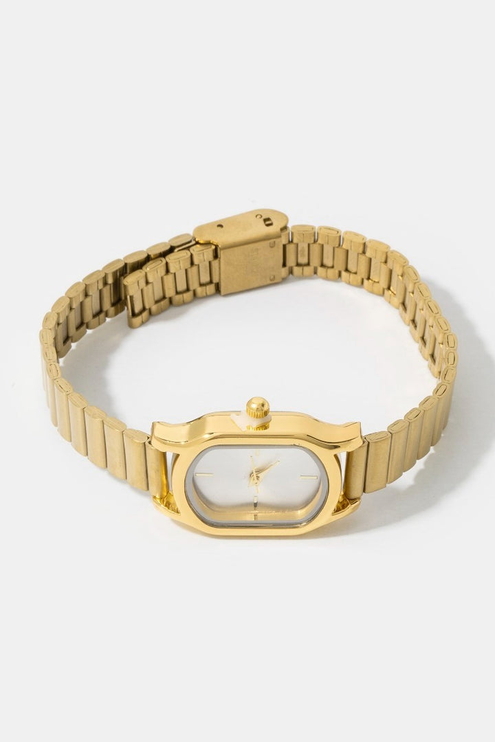 The Cushion Rectangle Bangle Watch in Gold - Three-Quarter Product Shot on White Background Showing Cushion Rectangle Case, Pearl White Dial with Gold Baton Indices & Ribbed Bracelet Band