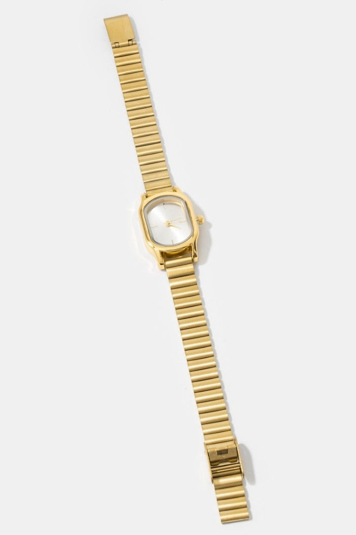 The Cushion Rectangle Bangle Watch in Gold - Full Product Flat Lay on White Background Showing Complete Watch with Ribbed Bracelet Band Fully Extended & Cushion Rectangle Case