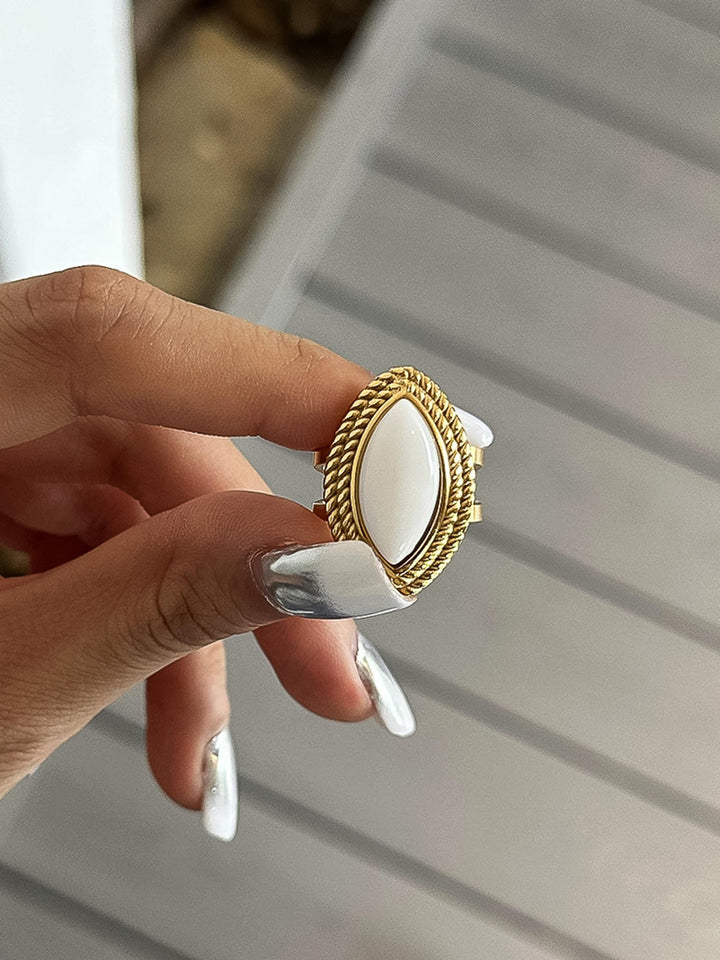 The Vintage Marquise Stone Statement Ring in 18K Gold - On-Model Close-Up Showing Ring Held Between Fingers Displaying Full Marquise Stone Face, Rope Bezel Detail & Split Double Band Back
