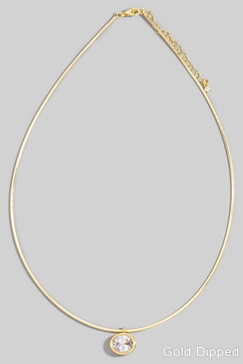 The Oval CZ Bezel Snake Chain Necklace in Gold Dipped - Full Product Flat Lay on Grey Background Showing Complete 14 Inch Snake Chain, Oval CZ Bezel Pendant & Lobster Clasp with 2 Inch Extension