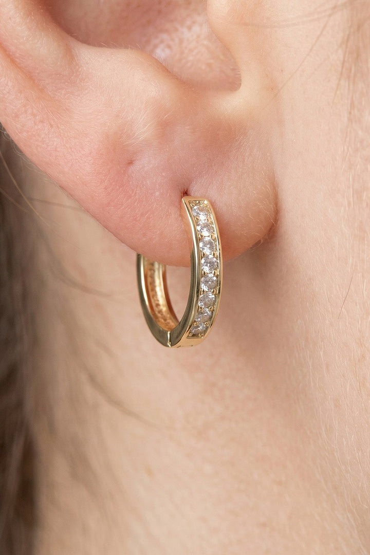 The Channel Set CZ Huggie Hoop Earrings — Gold