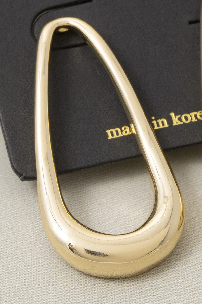 The Contour Open Teardrop Drop Earrings in Gold - Close-Up Detail Shot of Single Earring on Black Card Showing Polished Liquid Gold Mirror Finish & Continuous Loop Contour Form