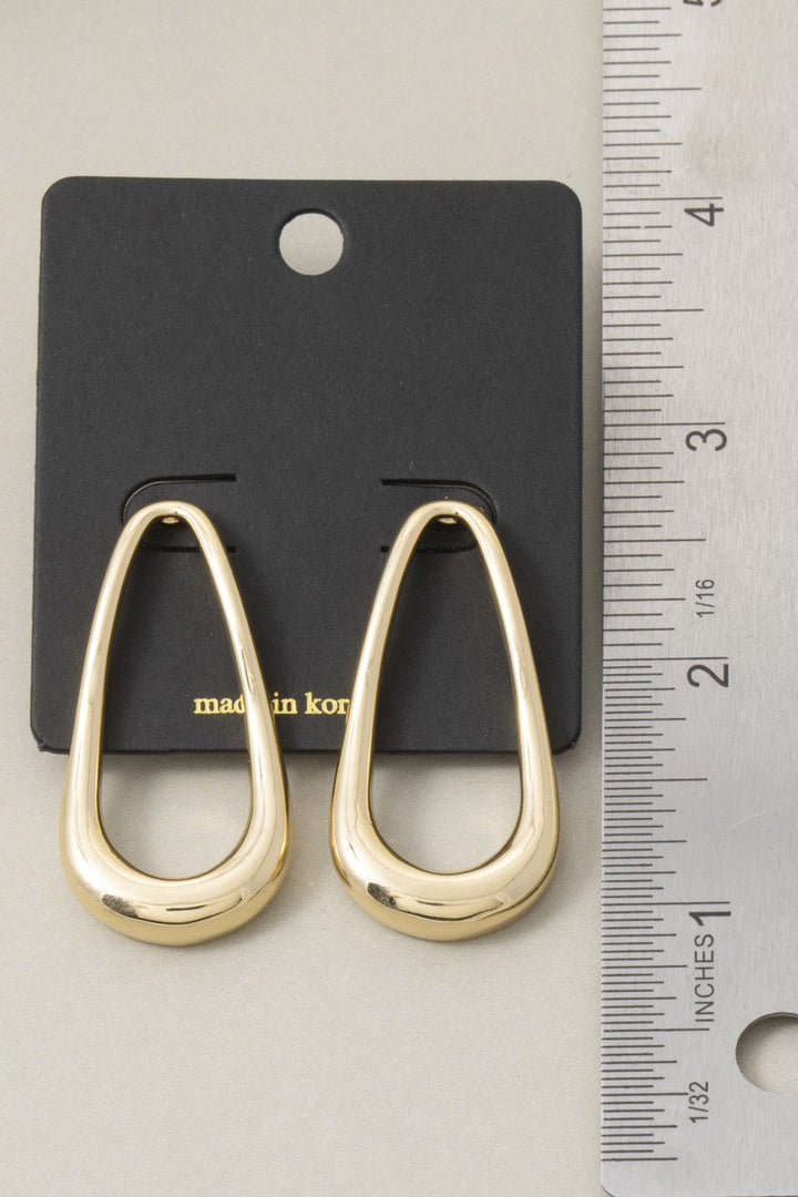 The Contour Open Teardrop Drop Earrings in Gold - Size Reference Shot on Black Card Against Ruler Showing Approximately 2 Inch Length of Polished Gold Open Teardrop Earrings