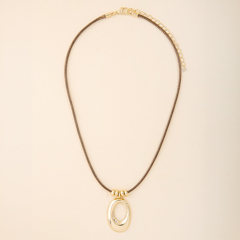 Sculptural Open Oval Pendant Woven Cord Necklace Gold