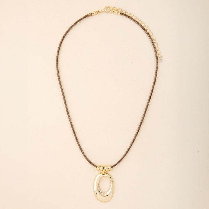 Sculptural Open Oval Pendant Woven Cord Necklace Gold