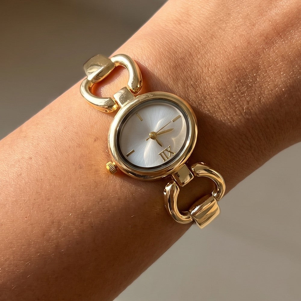 Gold Oval Case Roman Numeral Horsebit Link Bracelet Watch