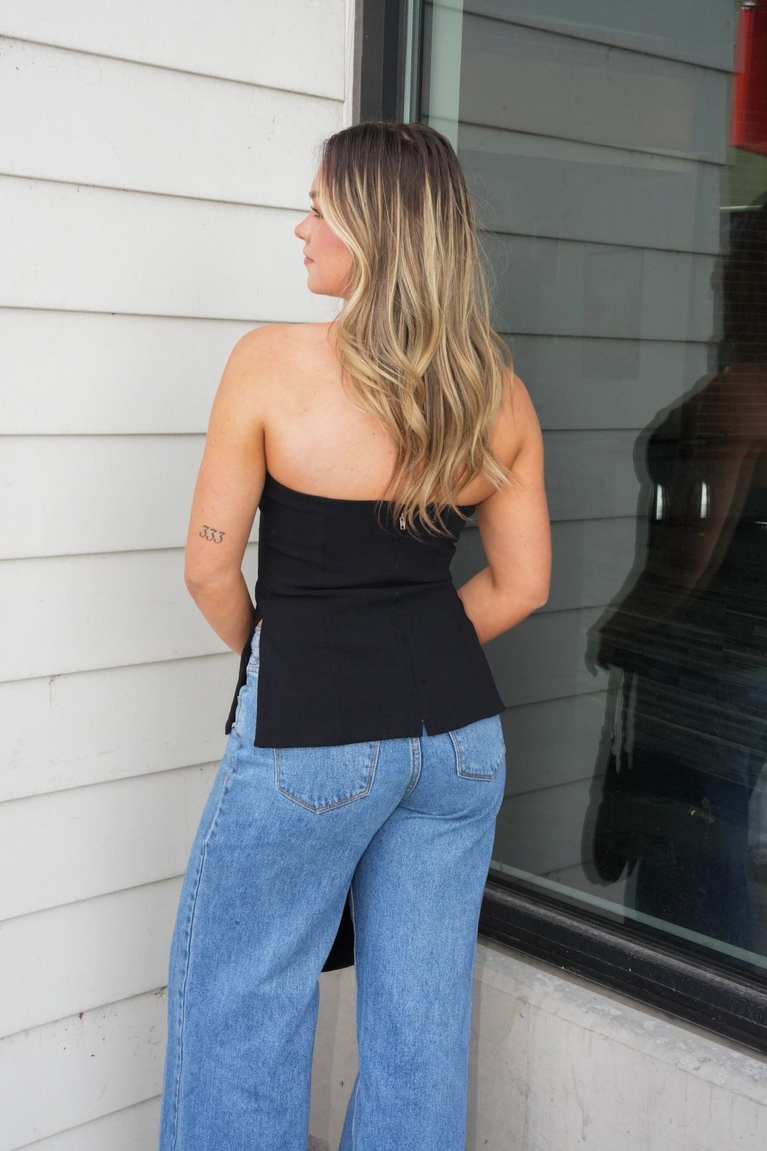 NOIR STRAPLESS PEPLUM TOP