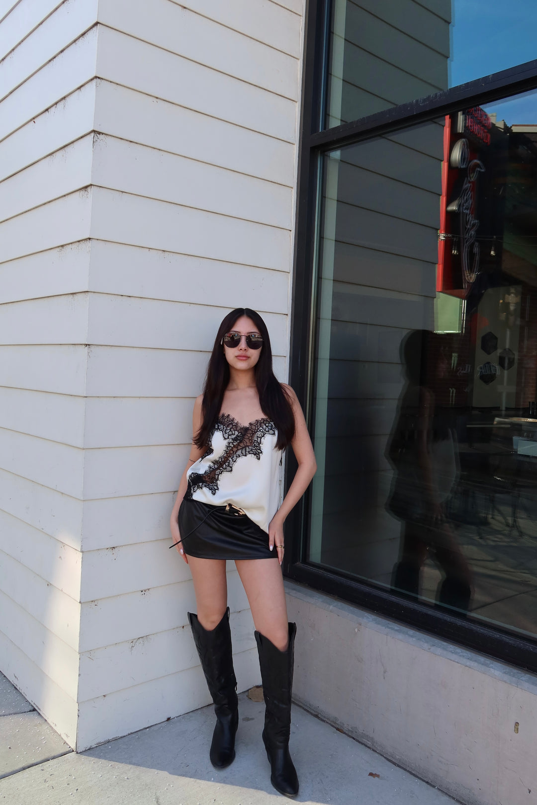 Midnight lace asymmetrical cami in black with uneven hem and delicate lace detail