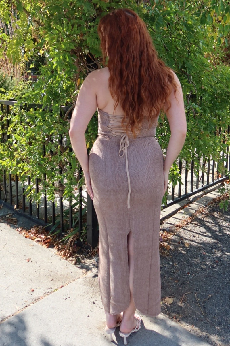 Back view of the taupe Karmen knitted maxi skirt with the matching corset top, full length