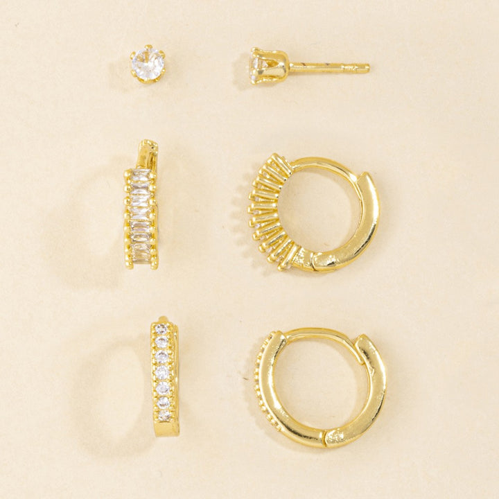 3 Pair Gold CZ Curated Ear Set — Sunburst Baguette Huggie, Milgrain Huggie & Solitaire Stud