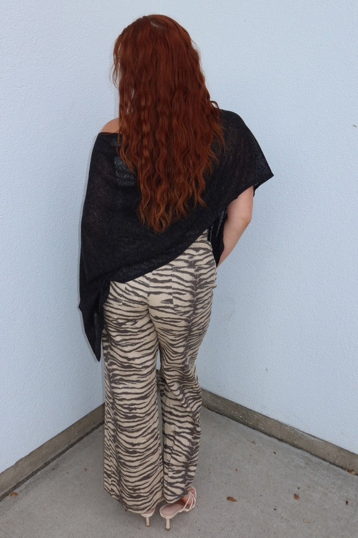 Back view of the Tiger print belted wide leg woven pants, full length with nude heels