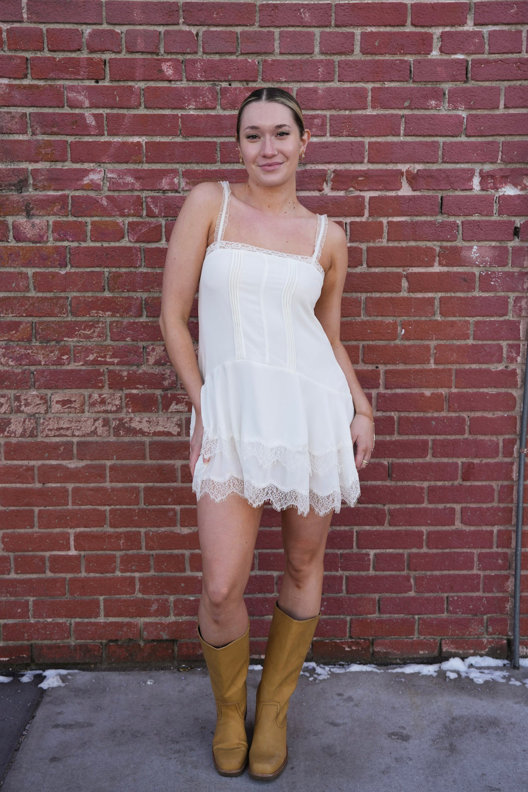 Amelie babydoll dress in white with delicate lace trim detail on neckline and hem