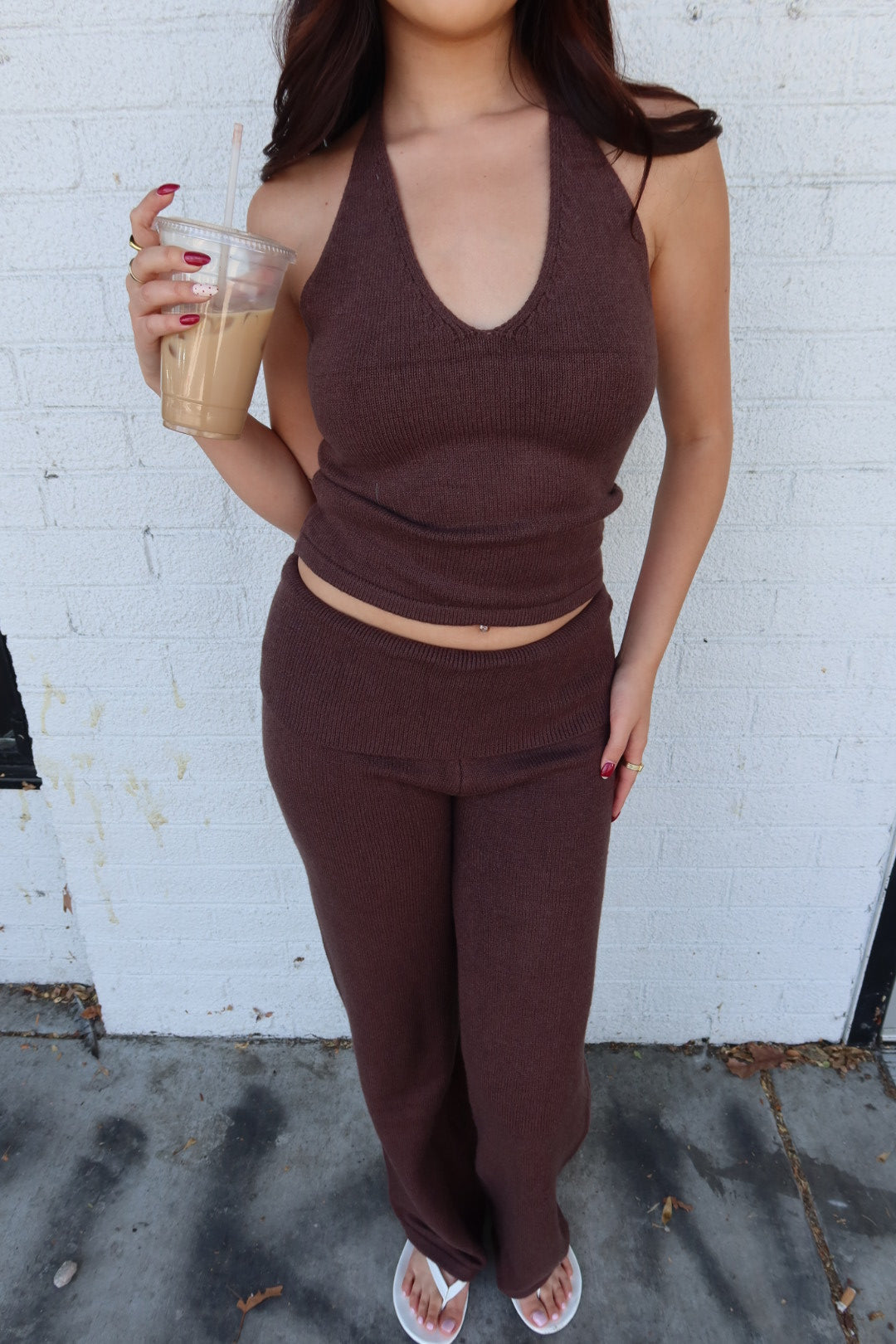 Close front view of the brown Kelsey knit halter top and trouser set, showing the V-neck halter and fold over waist